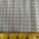 From Bump to Baby, white hearts on mid grey, 25cm cut WOF